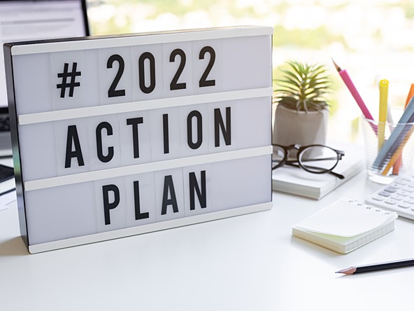 '2022 action plan' sign on desk